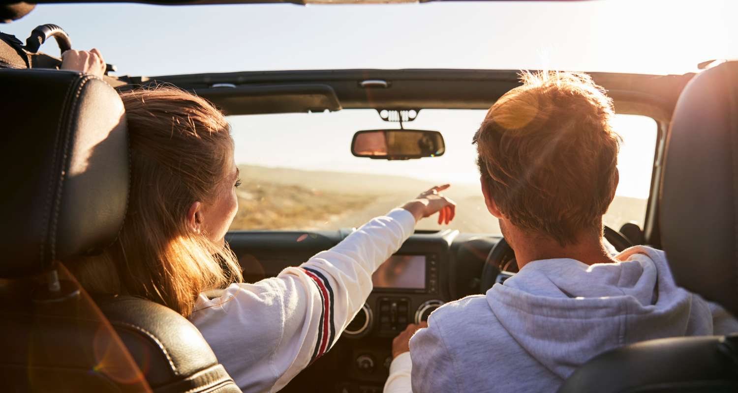 A couple enjoying a road trip, a safe and popular way to explore Montenegro