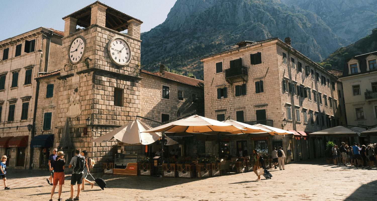 Tourists walking through the main square of Kotor Old Town