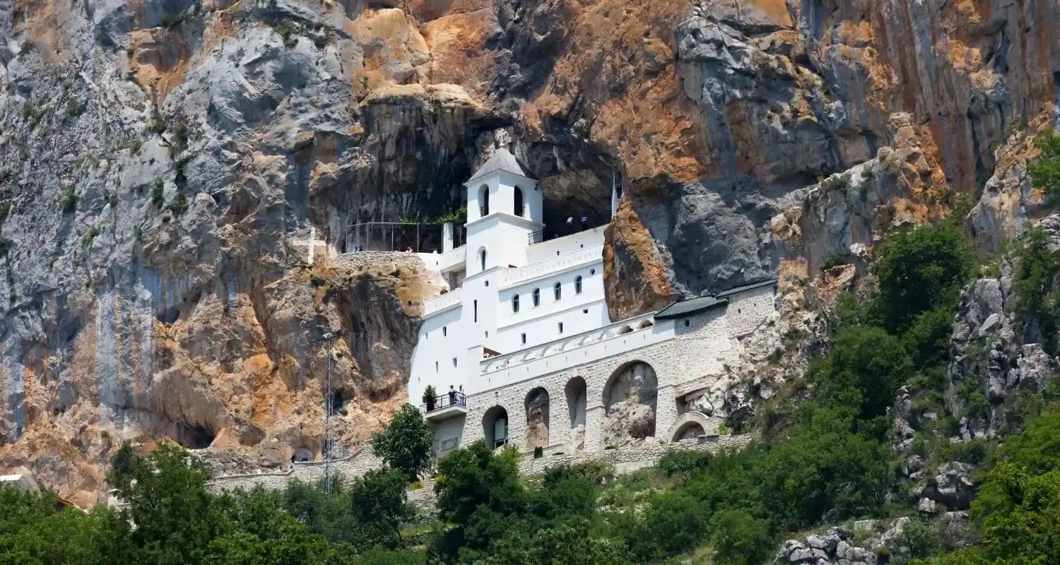 Ostrog Monastery built into the cliffs above the Bjelopavlići Plain