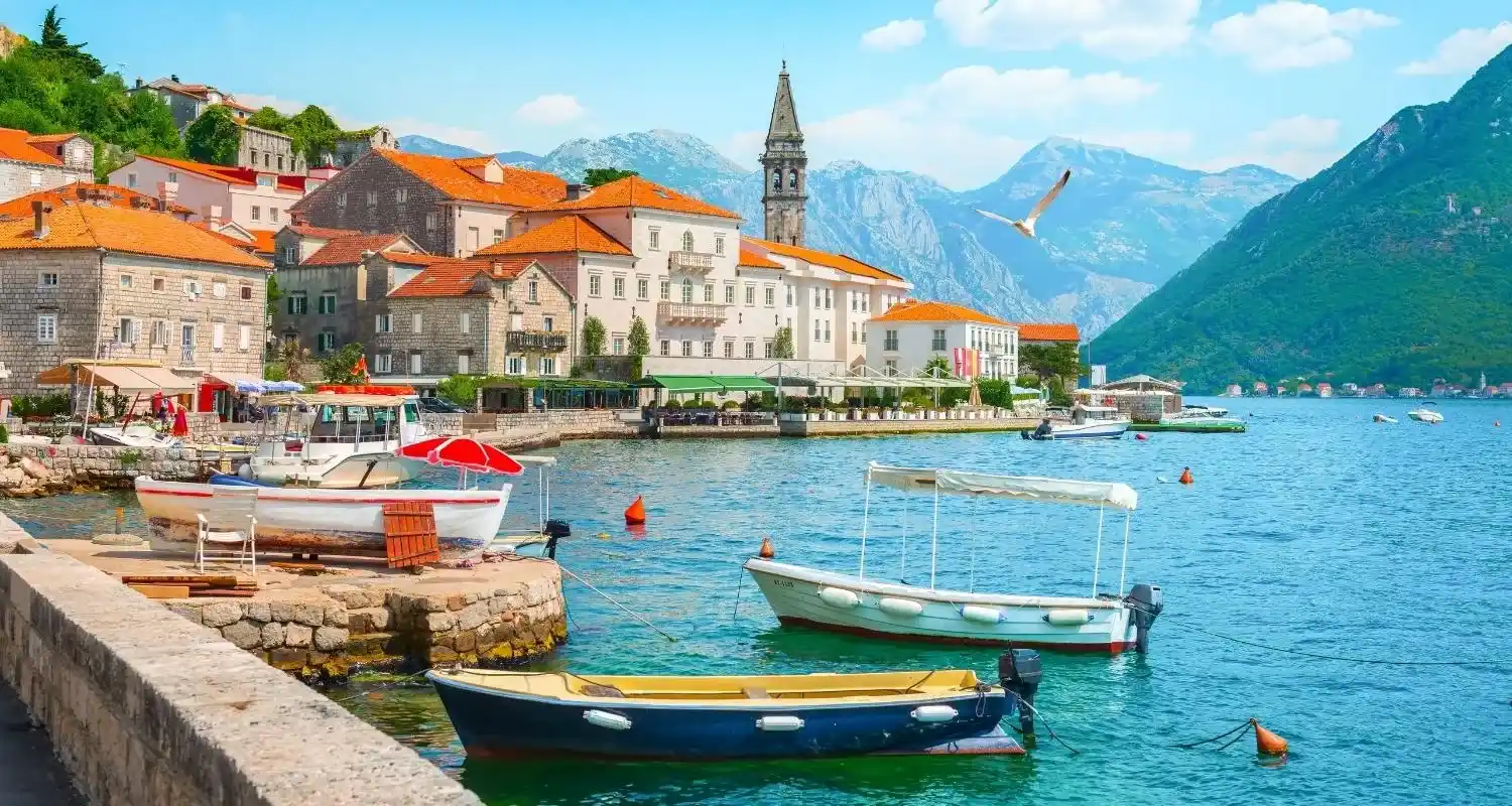 Perast on the Bay of Kotor with stone houses and boats along the waterfront